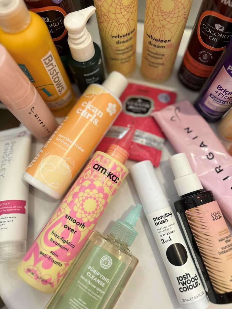 Shampoo and conditioner on a bathroom shelf